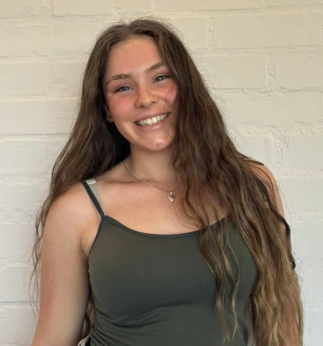 Portrait of Anelia Louw smiling with long hair