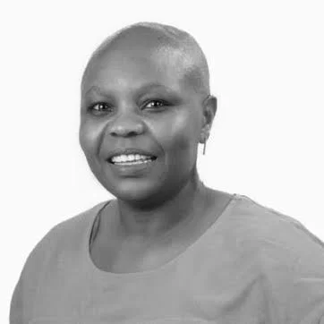 Black and white portrait of Sophie Tlhabadira smiling
