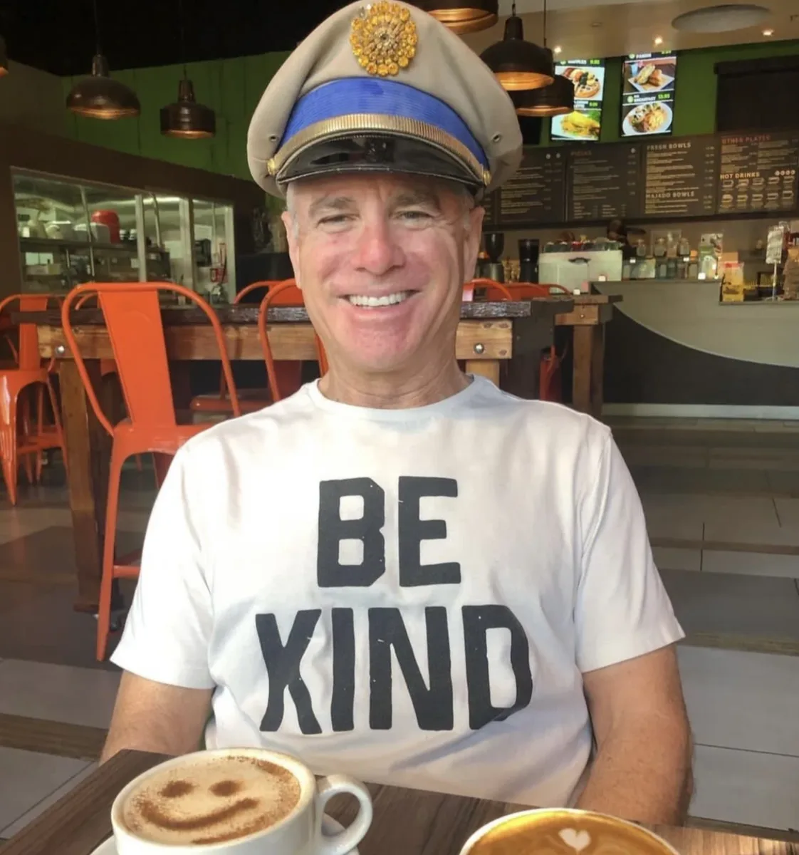 Portrait of Stuart Newton wearing a white captain's hat