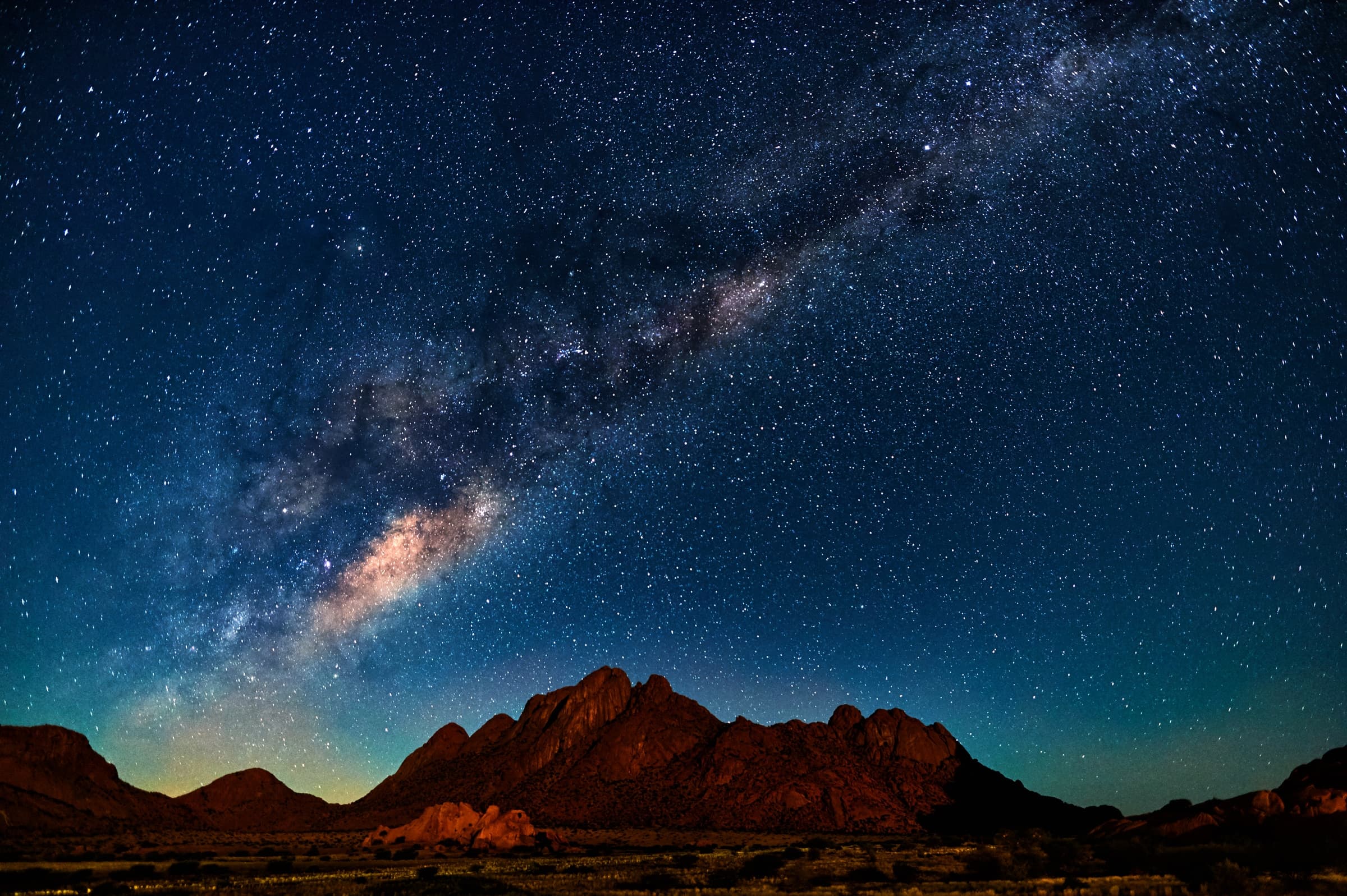 The Milky Way over a mountain range at night