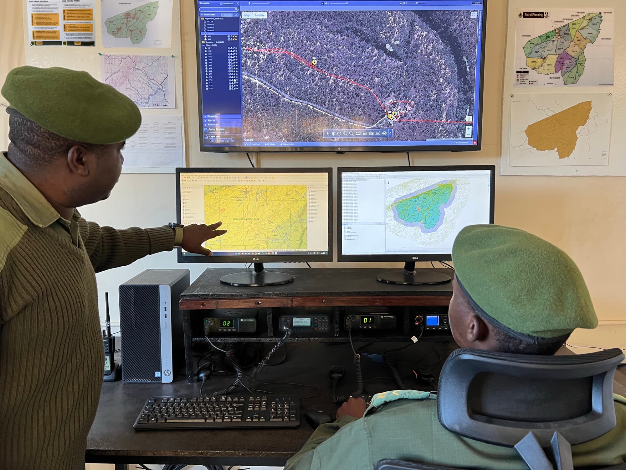 Rangers reviewing patrol tracking and mapping data in the Chizarira operations room